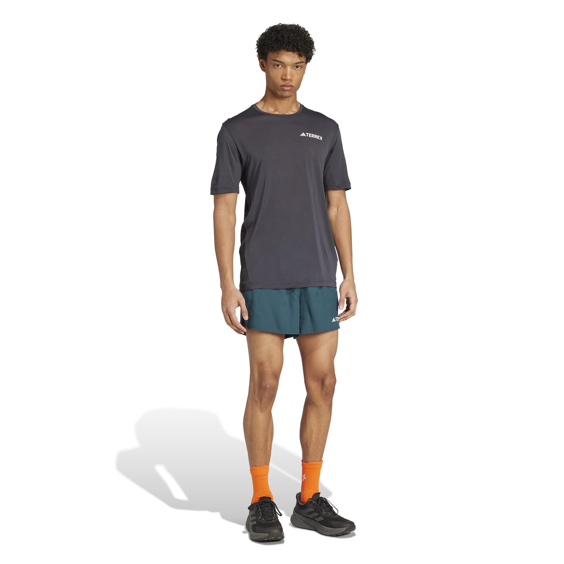 product/2/0/2025_adidas_jl6189_4_apparel_on_model_walking_view_white.jpg